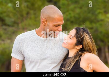 Portrait of fitness couple hugging and looking at each other Stock Photo