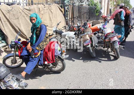 Herat, Afghanistan. 14th Aug, 2021. Taliban militants are seen in Herat province, Afghanistan, Aug. 13, 2021. The Afghan Taliban said their members overran three more provincial capitals on Friday, after they have taken control over a dozen cities within a week. Zabihullah Mujahid, a Taliban spokesman, wrote on his social media account that they captured Tirin Kot, capital of southern Uruzgan province, and Firoz Koah, capital of western Ghor province. Credit: Xinhua/Alamy Live News Stock Photo