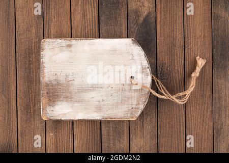 Old shabby wooden cutting board Stock Photo
