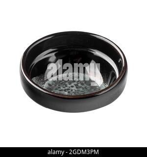 Isolated black asian soy sauce dish Stock Photo