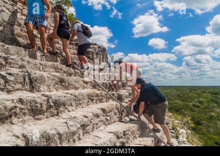 COBA, MEXICO - MARCH 1, 2016: Tourist climb the Pyramid Nohoch Mul at the ruins of the Mayan city Coba, Mexico Stock Photo