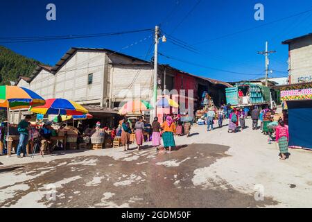 SAN MATEO IXTATAN, GUATEMALA, MARCH 19, 2016: Local indigenous people on a street in San Mateo Ixtatan village. Stock Photo