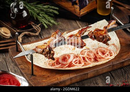 Grilled georgian lamb ribs shashlik skewers Stock Photo