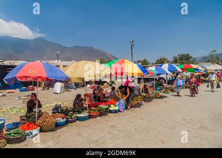 ANTIGUA, GUATEMALA - MARCH 26, 2016: Vegetable stalls at a local market in Antigua Guatemala town, Guatemala. Stock Photo