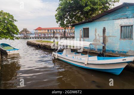 Boat and a pier in Livingston village, Guatemala Stock Photo