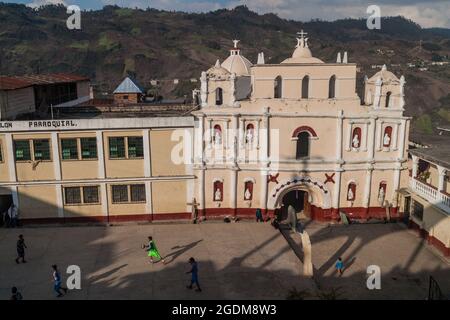 SAN MATEO IXTATAN, GUATEMALA, MARCH 18, 2016: View of a basketball field and a church in San Mateo Ixtatan village. Stock Photo