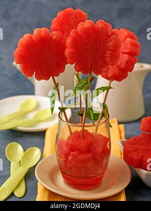 Flowers of watermelon with mint. Stock Photo