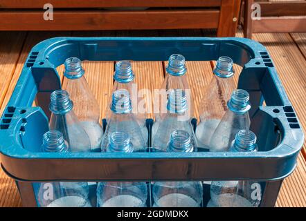 Empty water bottles in a crate to be recycled Stock Photo