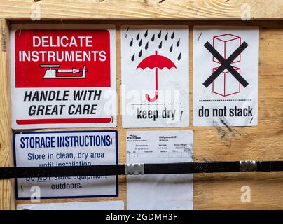 warning label beside transportation wooden box Stock Photo