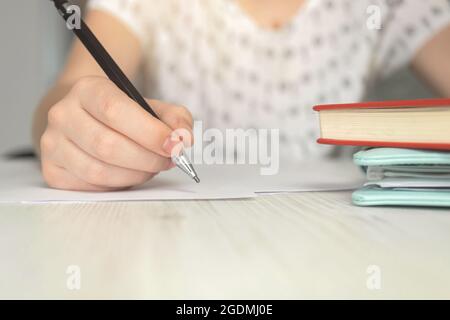 Woman starting create contract documents. Businesswoman office desk with paper, pen and notebooks background Stock Photo
