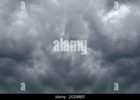 Dramatic sky background with dark storm clouds in dark sky. Black clouds before rainy. Stock Photo