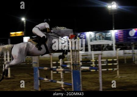 Gaza City, Gaza Strip, Palestine. 13th Aug, 2012. Gaza, Palestine. 13 August 2021. Male and female riders compete in the show-jumping championship at the Al Jawad Equestrian Club in Gaza City. The equestrian event has been organised by the Palestinian Equestrian Federation (Credit Image: © Ahmad Hasaballah/IMAGESLIVE via ZUMA Press Wire) Stock Photo