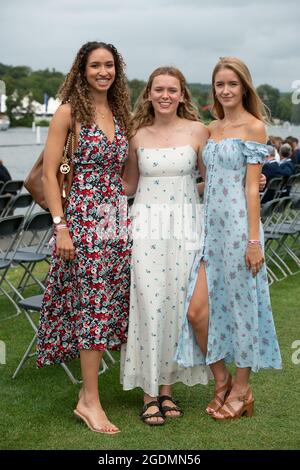 Henley, Oxfordshire, UK. 14th August, 2021. It was another busy day as  guests at Henley Royal Regatta enjoyed watching the rowing. The Dress Code  has been relaxed this year to allow ladies
