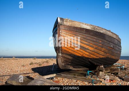 DUNGENESS, KENT, UK - DECEMBER 17 :  Beached Rowing Boat at Dungeness in Kent on December 17, 2008 Stock Photo