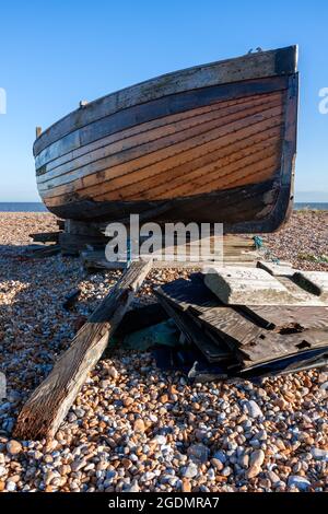 DUNGENESS, KENT, UK - DECEMBER 17 :  Beached Rowing Boat at Dungeness in Kent on December 17, 2008 Stock Photo