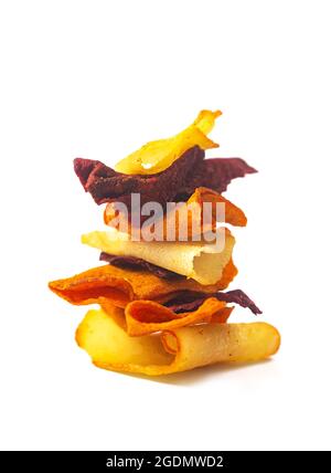 Vegetable veggie chips from potatoes, beets and carrots stacked in stack isolated on white background Stock Photo
