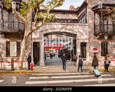 30 November 2018: Shanghai, China - Pedestrian crossing and the entrance to a shopping street in the Xintiandi district of Shanghai, part of the old F