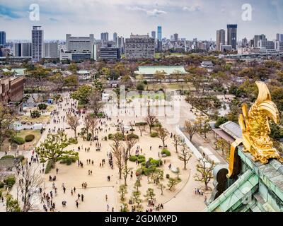 28 March 2019: Osaka, Japan - View from the top of the main keep of Osaka Castle, looking south across the grounds to the city skyline. Stock Photo