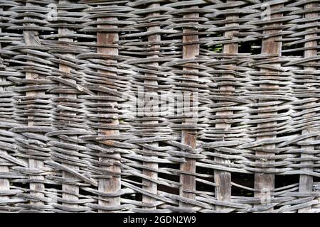 Close up details of a knitted wall made from wooden branches used to store corn in the villages in the old times Stock Photo