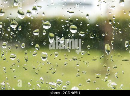 Rain droplets on a window pane, looking out Stock Photo