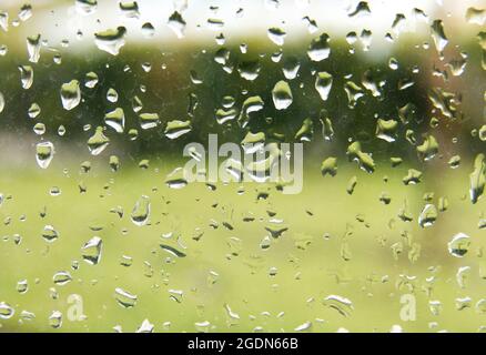 Rain droplets on a window pane, looking out Stock Photo