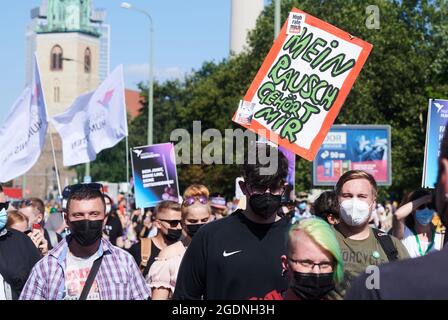 Berlin, Germany. 14th Aug, 2021. Demonstrators walk through the city during the hemp parade. 'My high belongs to me' is written on a poster. According to the organizers, the Hanfparade is the largest and most traditional demonstration for cannabis in Germany. Credit: Annette Riedl/dpa/Alamy Live News Stock Photo