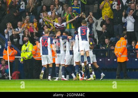 West Bromwich, UK. 25th June, 2021. West Bromwich Albion players celebrate in front of supporters after opening the scoring with a Kal Naismith (4) of Luton Town own goal during the Sky Bet Championship match between West Bromwich Albion and Luton Town at The Hawthorns, West Bromwich, England on 14 August 2021. Photo by David Horn. Credit: PRiME Media Images/Alamy Live News Stock Photo