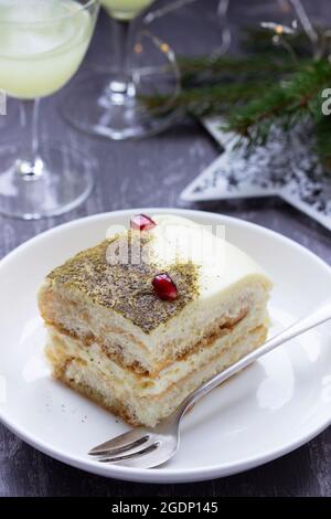 Italian dessert tiramisu, made with matcha tea and limoncello. Stock Photo