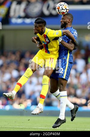 London, England, 14th August 2021. Wilfried Zaha of Crystal Palace and Antonio Rudiger of Chelsea challenge for the ball during the Premier League match at Stamford Bridge, London. Picture credit should read: Paul Terry / Sportimage Stock Photo