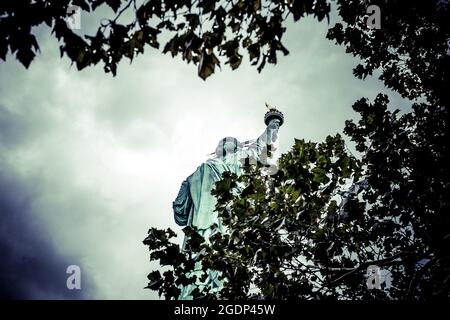 Walking around the Statue of liberty Stock Photo