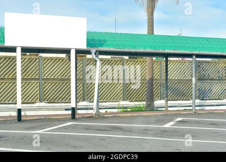 Blank White rectangular mockup billboard at the public parking Stock Photo