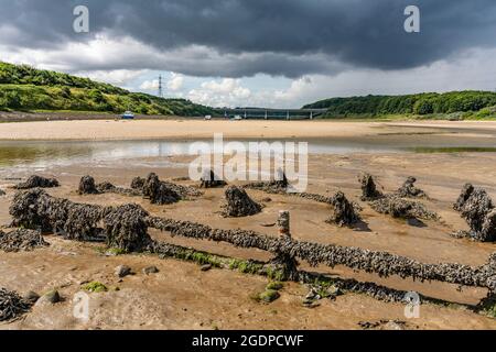 Estuary at the mouth of the River Wansbeck in Northumberland, A189 road bridge in background Stock Photo