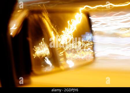 Abstract background with blurred lines around the wing mirror in fast moving car.  Graphic resources Stock Photo