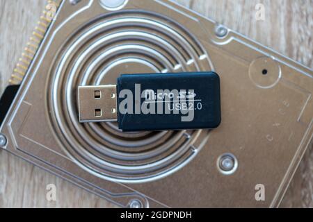 Close-up of a micro SD to SD adapter on a hard disk, USB pen Stock Photo