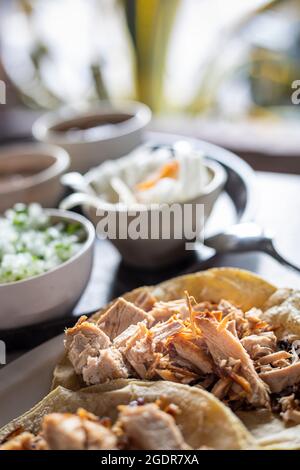 Roast pork or carnitas in a restaurant in Michoacan, Mexico. Stock Photo