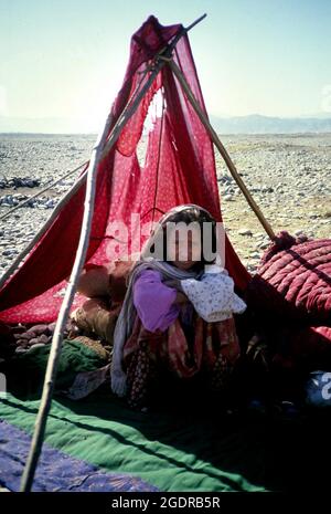 Circa 1980's, Afghanistan: Refugees in camps along the Pakistan-Afghanistan border. Insurgent groups in Afghanistan (known collectively as the mujahideen) fought a nine-year guerrilla war against the Soviet Army and the Democratic Republic of Afghanistan government throughout the 1980s, mostly in the Afghan countryside. In what was a Cold War-era proxy war, the Mujahideen were backed by the United States, Pakistan, Iran, Saudi Arabia, China, and the United Kingdom. (Credit Image: © Mark Richards/ZUMA Press Wire Service) Stock Photo