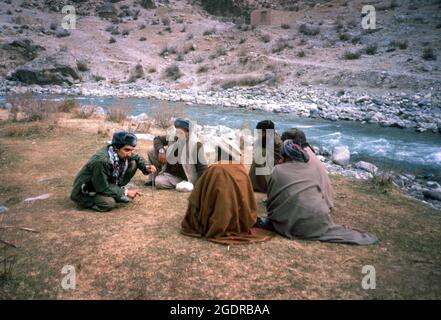 Circa 1980's, Afghanistan: Mujahideen Fighting against USSR in the rugged, inhospitable terrain of Afghanistan. Insurgent groups in Afghanistan (known collectively as the mujahideen) fought a nine-year guerrilla war against the Soviet Army and the Democratic Republic of Afghanistan government throughout the 1980s, mostly in the Afghan countryside. In what was a Cold War-era proxy war, the Mujahideen were backed by the United States, Pakistan, Iran, Saudi Arabia, China, and the United Kingdom. (Credit Image: © Mark Richards/ZUMA Press Wire Service) Stock Photo