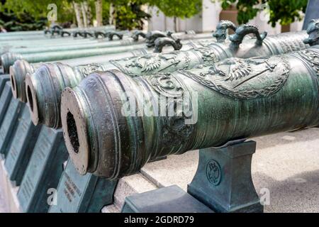 Moscow - June 2, 2021: Medieval cannons inside Moscow Kremlin, Russia. This place is famous tourist attraction of Moscow. Old bronze cannon barrels in Stock Photo