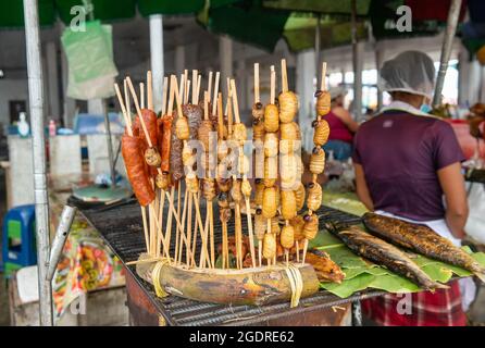 Fried Suri worms Rhynchophorus palmarum on a market in Iquitos, Peru. Stock Photo