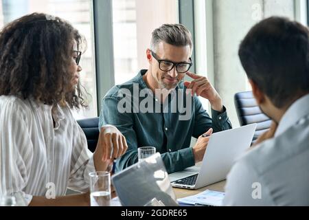 Diverse business executive team working together at boardroom meeting. Stock Photo
