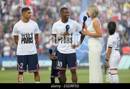 Achraf Hakimi, Georginio Wijnaldum of PSG during the new recruits' presentation ahead of the French championship Ligue 1 football match between Paris Saint-Germain and RC Strasbourg on August 14, 2021 at Parc des Princes stadium in Paris, France - Photo Jean Catuffe / DPPI Stock Photo