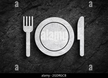 Fork knife and plate symbol and gastronomy or cooking symbol on dark stone wall background Stock Photo