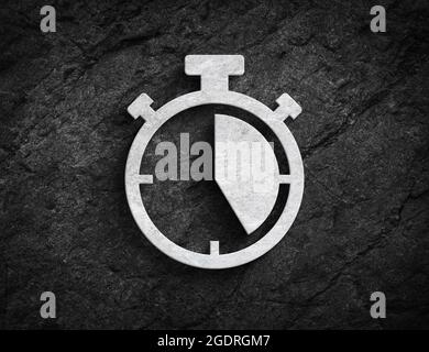 Classic stopwatch symbol sport start and stop clock stone wall background Stock Photo