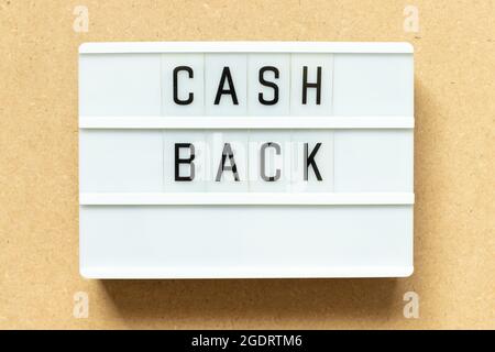 Lightbox with word cash back on wood background Stock Photo
