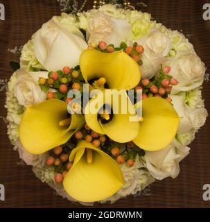 Bouquet of yellow lilies and roses Stock Photo