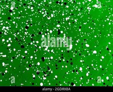 Green cement wall decorated with black and white dots pattern style. Stock Photo