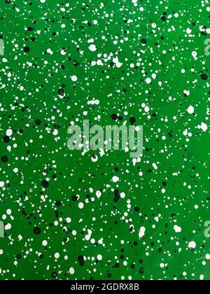 Vertical green cement wall decorated with black and white dots pattern style. Stock Photo