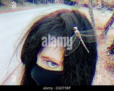 Portrait of a woman with a computer glitch effect. Face close-up with protective facial mask and dead dragonfly on hair. Fragility of being. Long road Stock Photo