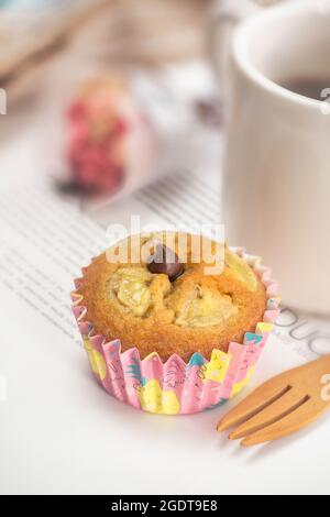 Fresh homemade banana muffin decorated with chocolate chip on the table Stock Photo
