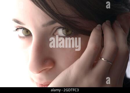 close up portrait of girl face with beautiful eyes who are looking at the camera Stock Photo